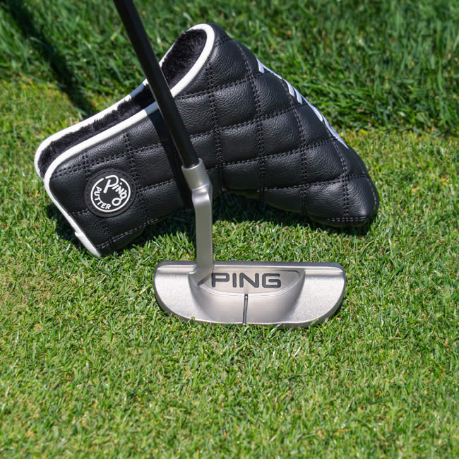 PING 2024 B63 putter with head cover on putting green