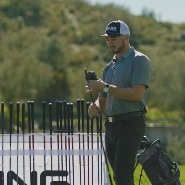 fitter reviewing results with golfer
