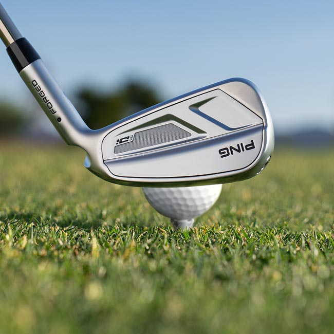 Rear view of iDi iron addressing a golf ball