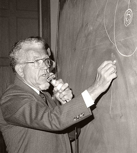 Karsten Solheim writing on chalk board